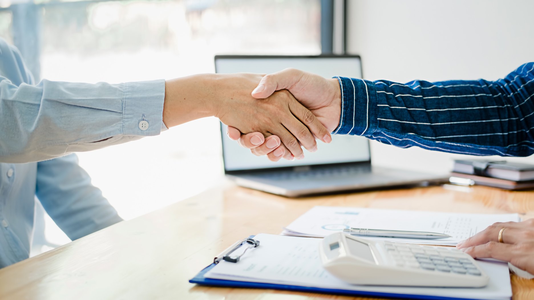 Business Partners Shaking Hands After Meeting 